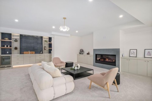 2945 Toronto Crescent Nw, Calgary, AB - Indoor Photo Showing Living Room With Fireplace