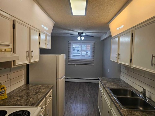 105-5812 61 Street, Red Deer, AB - Indoor Photo Showing Kitchen With Double Sink