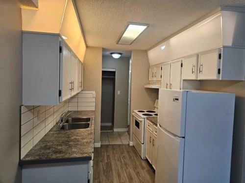 105-5812 61 Street, Red Deer, AB - Indoor Photo Showing Kitchen With Double Sink