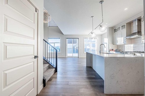 300 Savanna Way Ne, Calgary, AB - Indoor Photo Showing Kitchen With Upgraded Kitchen