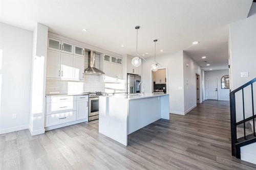 300 Savanna Way Ne, Calgary, AB - Indoor Photo Showing Kitchen With Upgraded Kitchen
