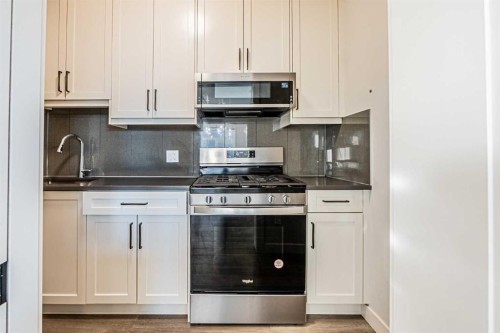 300 Savanna Way Ne, Calgary, AB - Indoor Photo Showing Kitchen With Upgraded Kitchen
