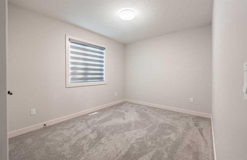 300 Savanna Way Ne, Calgary, AB - Indoor Photo Showing Other Room