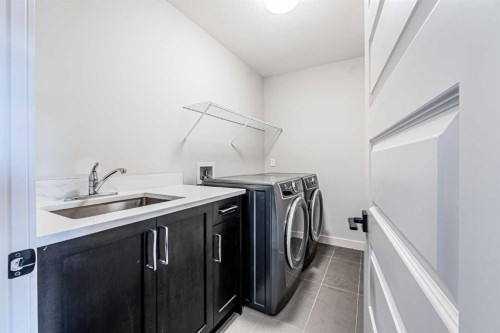 300 Savanna Way Ne, Calgary, AB - Indoor Photo Showing Laundry Room