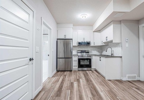 300 Savanna Way Ne, Calgary, AB - Indoor Photo Showing Kitchen