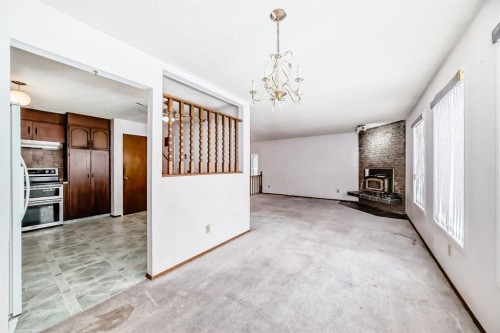 11 Falwood Place Ne, Calgary, AB - Indoor With Fireplace