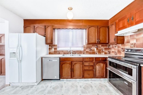 11 Falwood Place Ne, Calgary, AB - Indoor Photo Showing Kitchen With Double Sink