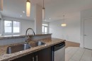 101-320 12 Avenue Ne, Calgary, AB  - Indoor Photo Showing Kitchen With Double Sink 