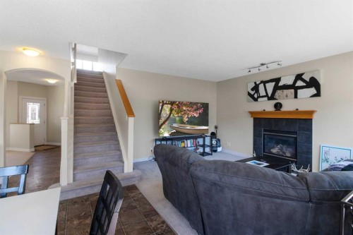 344 Windermere Drive, Chestermere, AB - Indoor Photo Showing Living Room With Fireplace