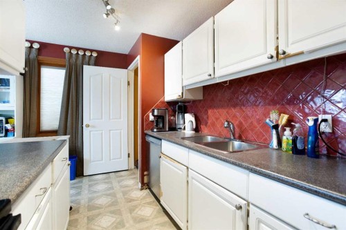 11 Ridgebrook Drive Sw, Airdrie, AB - Indoor Photo Showing Kitchen With Double Sink