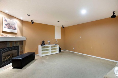 11 Ridgebrook Drive Sw, Airdrie, AB - Indoor With Fireplace