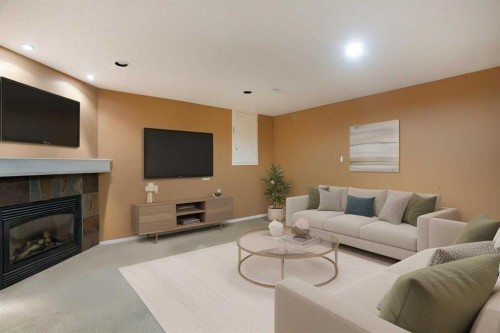 11 Ridgebrook Drive Sw, Airdrie, AB - Indoor Photo Showing Living Room With Fireplace