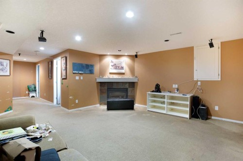 11 Ridgebrook Drive Sw, Airdrie, AB - Indoor With Fireplace
