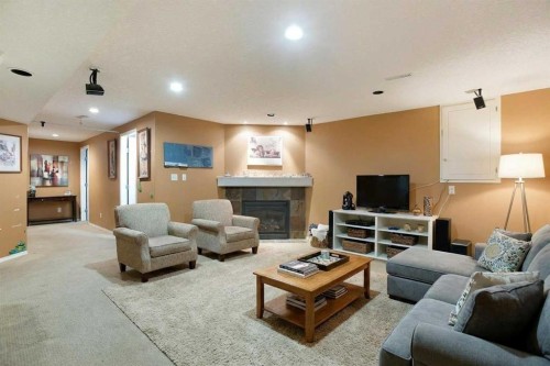 11 Ridgebrook Drive Sw, Airdrie, AB - Indoor Photo Showing Living Room With Fireplace