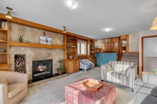 244 Ranchridge Court Nw, Calgary, AB - Indoor Photo Showing Living Room With Fireplace