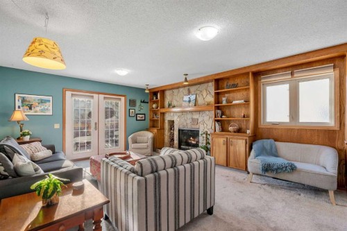 244 Ranchridge Court Nw, Calgary, AB - Indoor Photo Showing Living Room With Fireplace