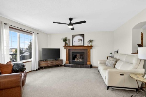 228 Sagewood Landing Sw, Airdrie, AB - Indoor Photo Showing Living Room With Fireplace
