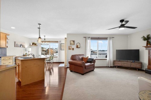 228 Sagewood Landing Sw, Airdrie, AB - Indoor Photo Showing Living Room With Fireplace