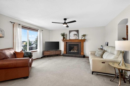 228 Sagewood Landing Sw, Airdrie, AB - Indoor Photo Showing Living Room With Fireplace