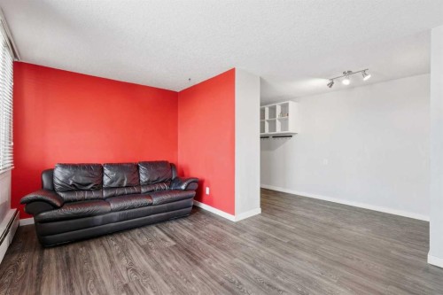 707-4944 Dalton Drive Nw, Calgary, AB - Indoor Photo Showing Living Room