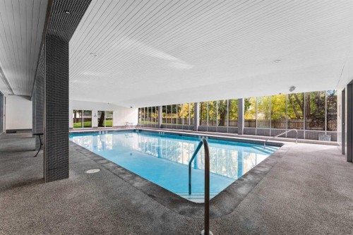 707-4944 Dalton Drive Nw, Calgary, AB -  With In Ground Pool