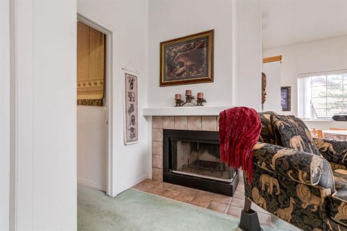 809-1997 Sirocco Drive Sw, Calgary, AB - Indoor Photo Showing Living Room With Fireplace