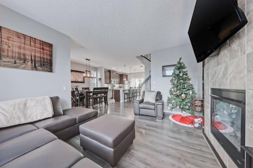 300 Marquis Heights Se, Calgary, AB - Indoor Photo Showing Living Room With Fireplace