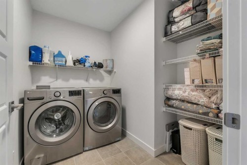 172 Precedence Hill, Cochrane, AB - Indoor Photo Showing Laundry Room