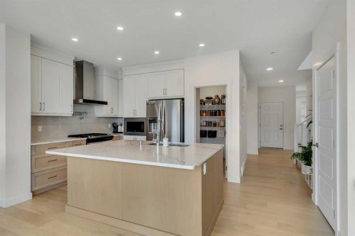 172 Precedence Hill, Cochrane, AB - Indoor Photo Showing Kitchen With Upgraded Kitchen