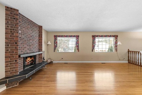 10727 Mapleglen Crescent Se, Calgary, AB - Indoor With Fireplace