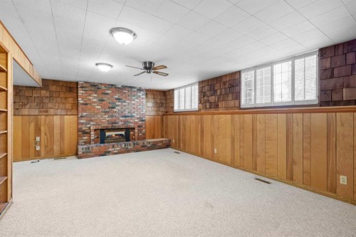 10727 Mapleglen Crescent Se, Calgary, AB - Indoor Photo Showing Other Room With Fireplace