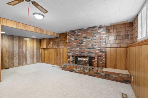 10727 Mapleglen Crescent Se, Calgary, AB - Indoor Photo Showing Other Room With Fireplace