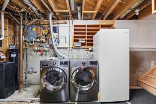 10727 Mapleglen Crescent Se, Calgary, AB - Indoor Photo Showing Laundry Room