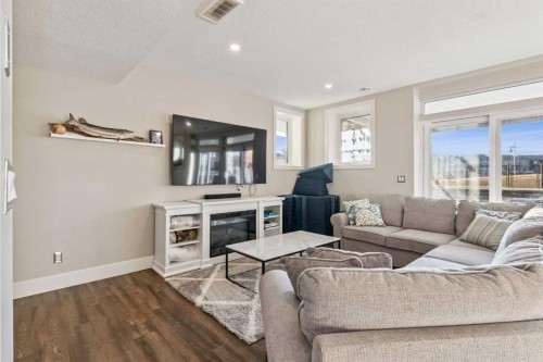163 Masters Cove Se, Calgary, AB - Indoor Photo Showing Living Room With Fireplace