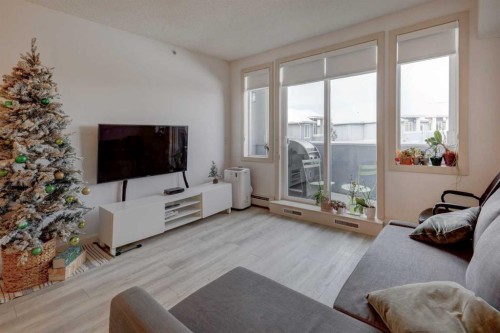 402-120 Country Village Circle Ne, Calgary, AB - Indoor Photo Showing Living Room