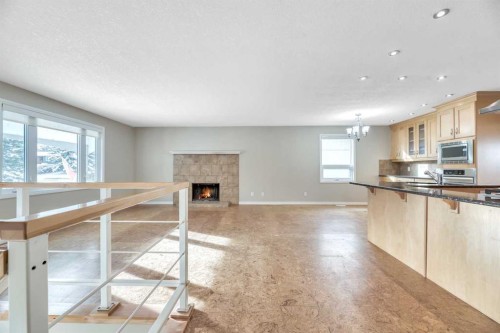 124 Deercrest Close Se, Calgary, AB - Indoor Photo Showing Kitchen With Fireplace