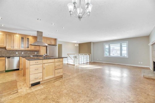 124 Deercrest Close Se, Calgary, AB - Indoor Photo Showing Kitchen With Fireplace