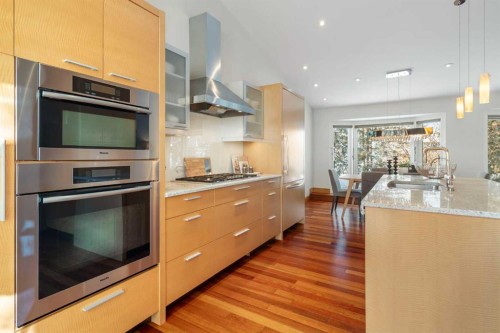 211 Coach Side Road Sw, Calgary, AB - Indoor Photo Showing Kitchen With Upgraded Kitchen