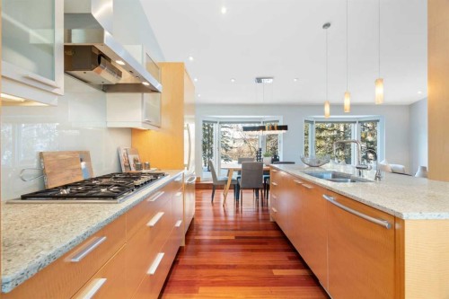 211 Coach Side Road Sw, Calgary, AB - Indoor Photo Showing Kitchen With Double Sink With Upgraded Kitchen