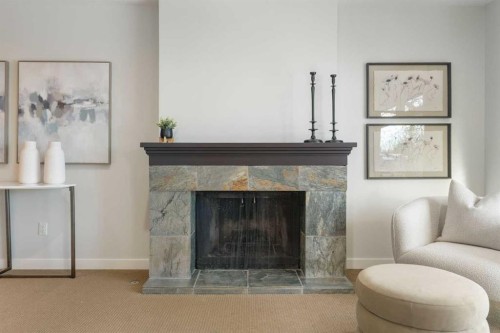 211 Coach Side Road Sw, Calgary, AB - Indoor Photo Showing Living Room With Fireplace
