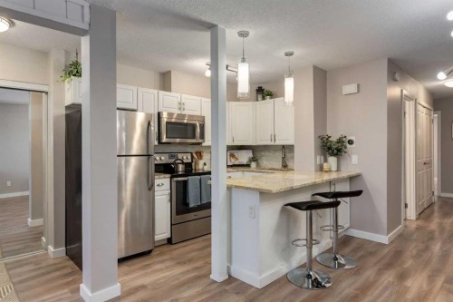 308-13104 Elbow Drive Sw, Calgary, AB - Indoor Photo Showing Kitchen With Upgraded Kitchen
