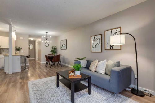 308-13104 Elbow Drive Sw, Calgary, AB - Indoor Photo Showing Living Room