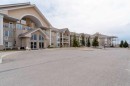 211-728 Country Hills Road Nw, Calgary, AB  - Outdoor With Balcony With Facade 