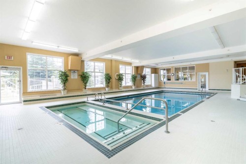 211-728 Country Hills Road Nw, Calgary, AB - Indoor Photo Showing Other Room With In Ground Pool