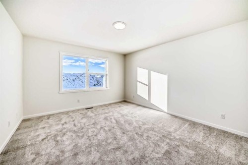 32 Southborough Common, Cochrane, AB - Indoor Photo Showing Other Room