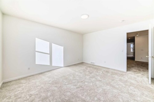 32 Southborough Common, Cochrane, AB - Indoor Photo Showing Other Room