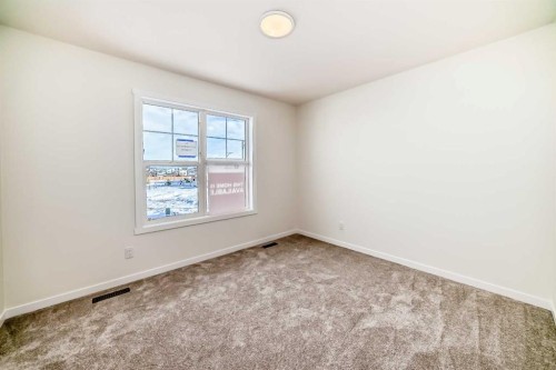 32 Southborough Common, Cochrane, AB - Indoor Photo Showing Other Room