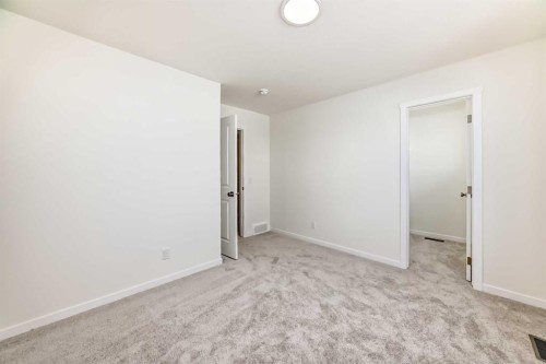 32 Southborough Common, Cochrane, AB - Indoor Photo Showing Other Room