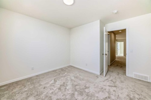 32 Southborough Common, Cochrane, AB - Indoor Photo Showing Other Room