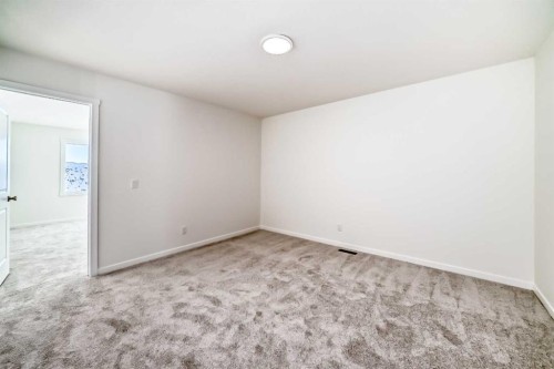 32 Southborough Common, Cochrane, AB - Indoor Photo Showing Other Room